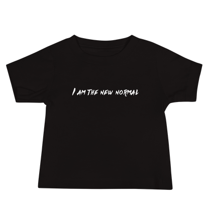 "I am the new normal" printed on a black baby jersey short sleeve tee laying on a flat surface