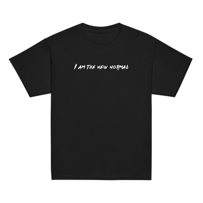 "I am the new normal" printed on a black youth classic tee laying on a flat surface