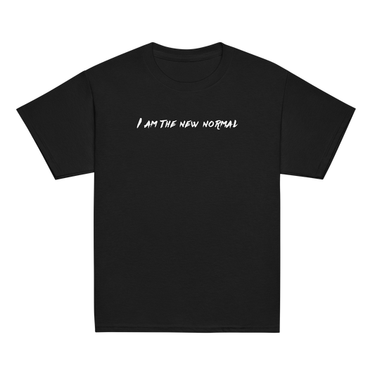"I am the new normal" printed on a black youth classic tee laying on a flat surface