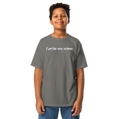 "I am the new normal" printed on a charcoal youth classic tee worn by a male