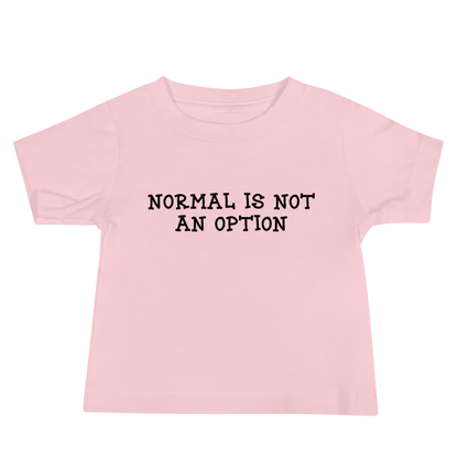"Normal is not an option" printed on a pink baby jersey short sleeve tee laying on a flat surface
