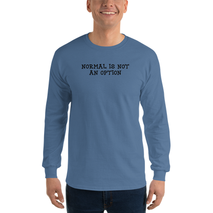 "Normal is not an option" printed on a indigo blue men's long sleeve shirt worn by a male