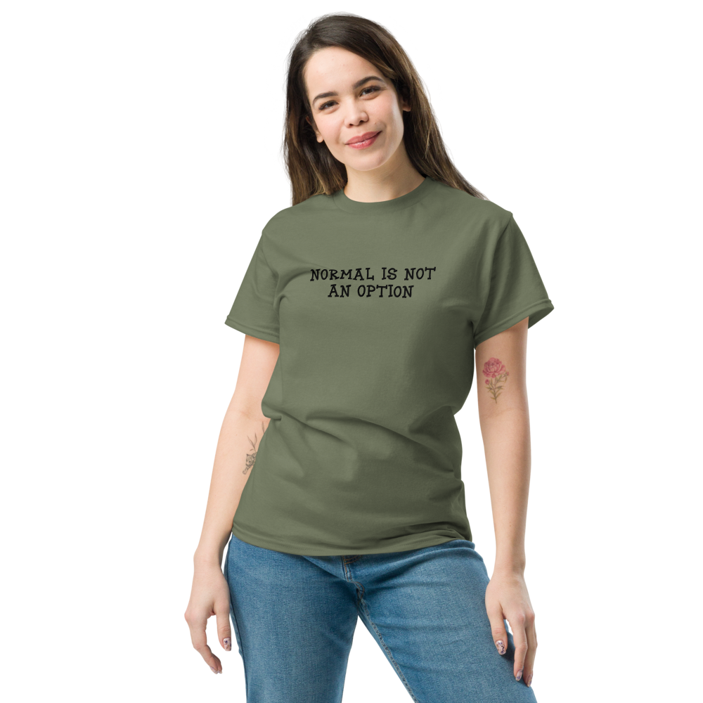 "Normal is not an option" printed on a military green unisex classic tee worn by a female
