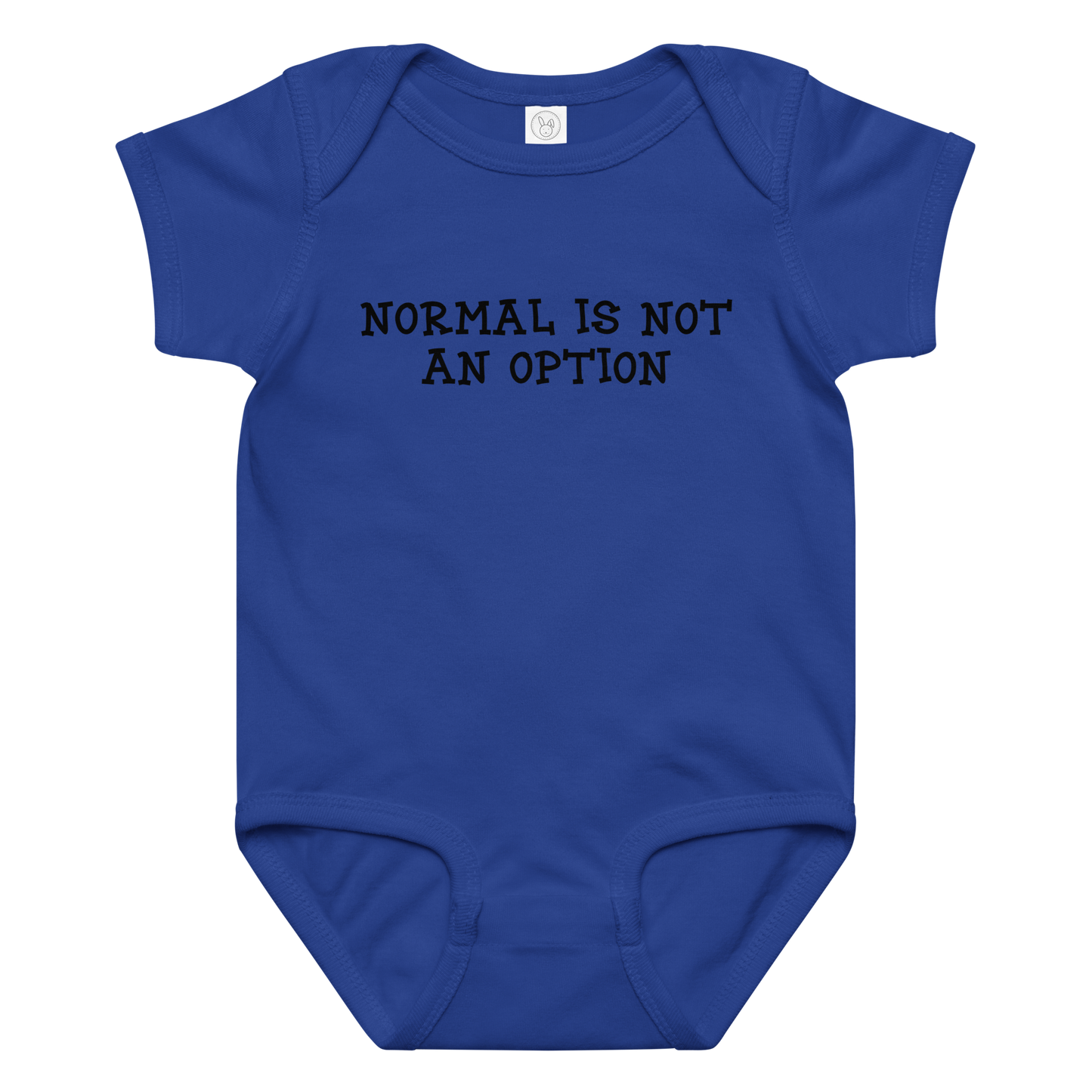 "Normal is not an option" printed on a royal baby jersey bodysuit laying on a flat surface amongst other clothes