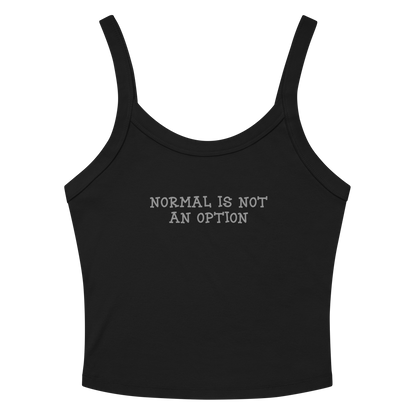 "Normal is not an option" printed on a solid black blend women's micro-rib tanktop laying on a flat surface amongst sunglasses and shorts