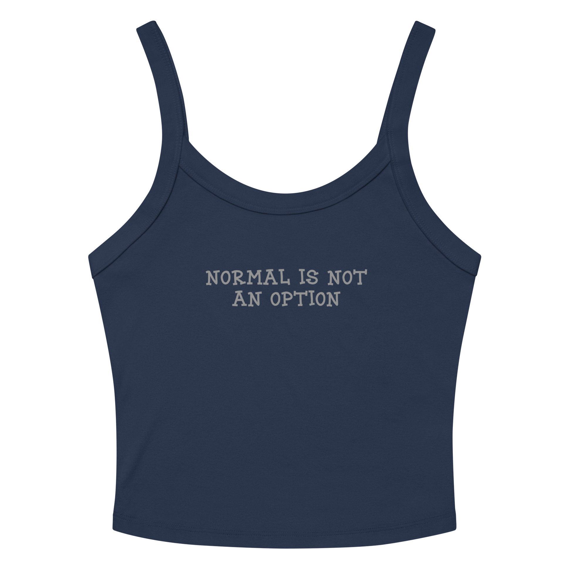 "Normal is not an option" printed on a solid navy blend women's micro-rib tanktop laying on a flat surface amongst sunglasses and shorts