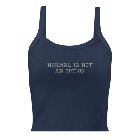 "Normal is not an option" printed on a solid navy blend women's micro-rib tanktop laying on a flat surface