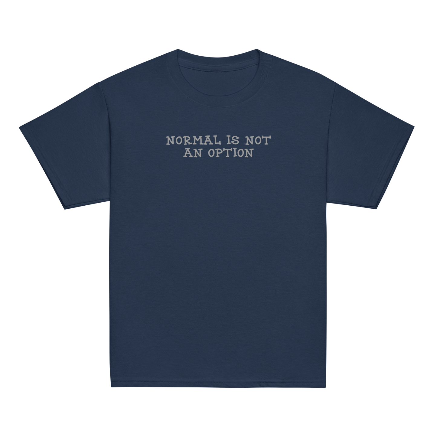 "Normal is not an option" printed on a navy youth classic tee laying on a flat surface