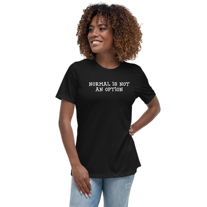 "Normal is not an option" printed on a black women's relaxed t-shirt worn by a female