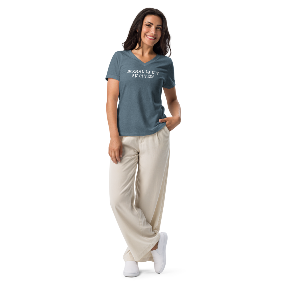 "Normal is not an option" printed on a heather slate women's relaxed v-neck t-shirt worn by a female