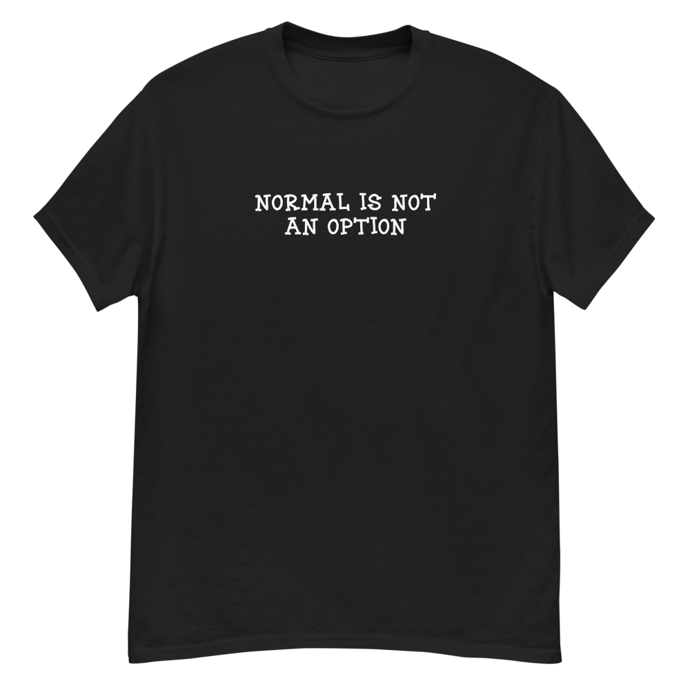 "Normal is not an option" printed on a black unisex classic tee laying on a flat surface