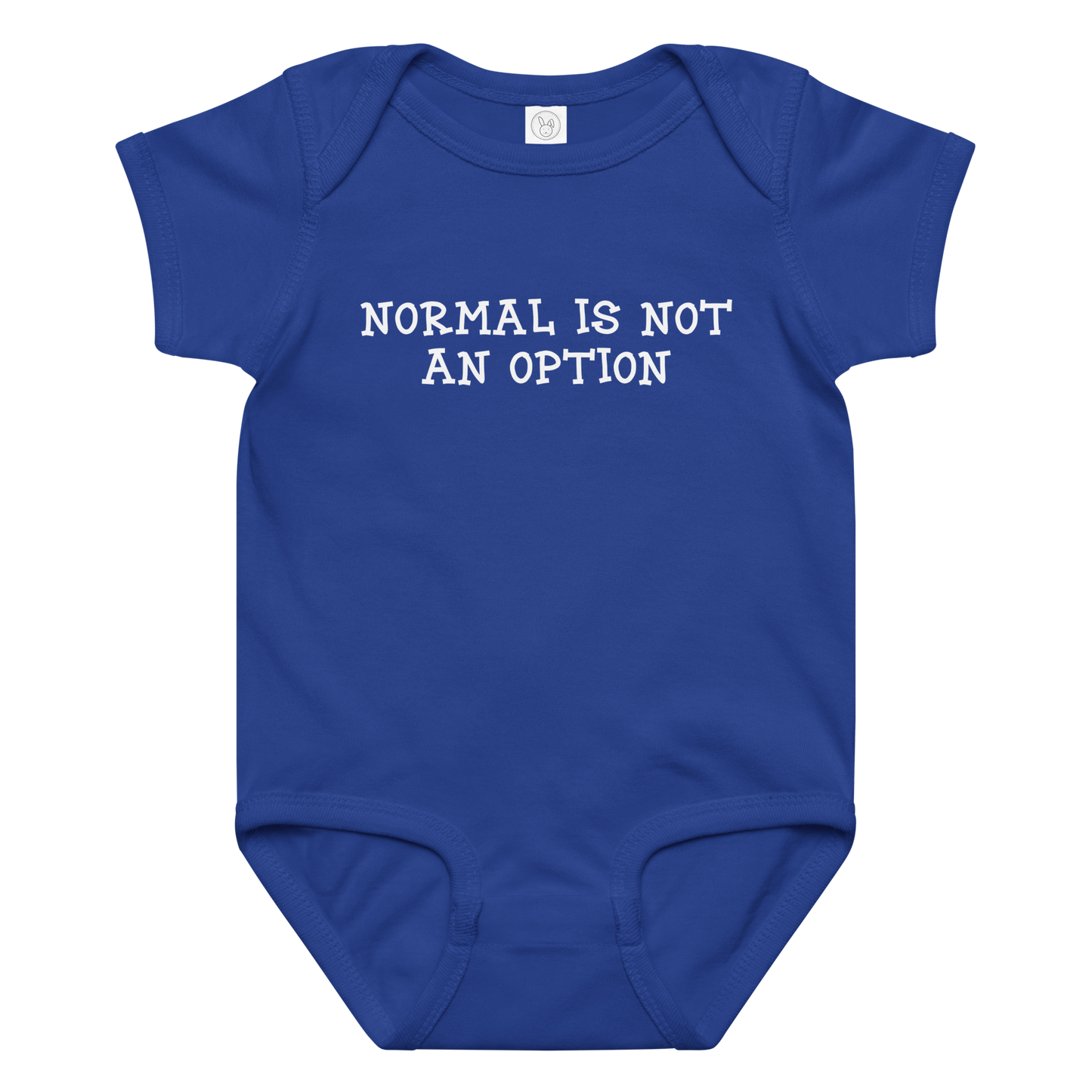 "Normal is not an option" printed on a royal baby jersey bodysuit laying on a flat surface amongst other clothes