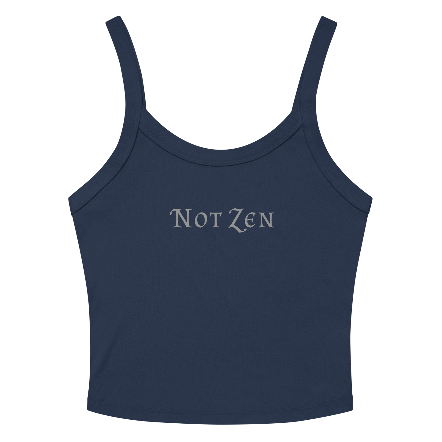 "Not zen" printed on a solid navy blend women's micro-rib tanktop laying on a flat surface amongst sunglasses and shorts