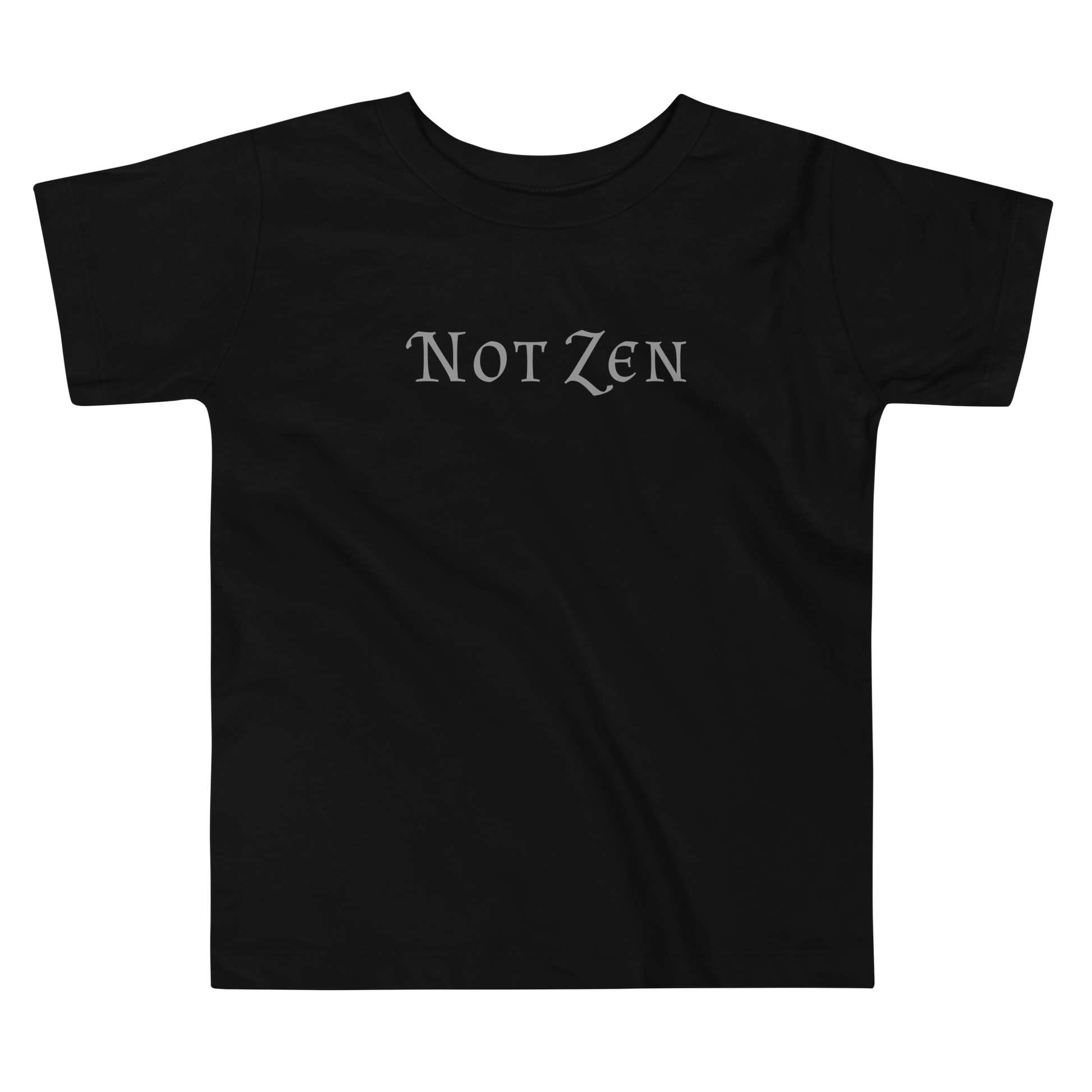 "Not zen" printed on a black toddler short sleeve tee laying on a flat surface