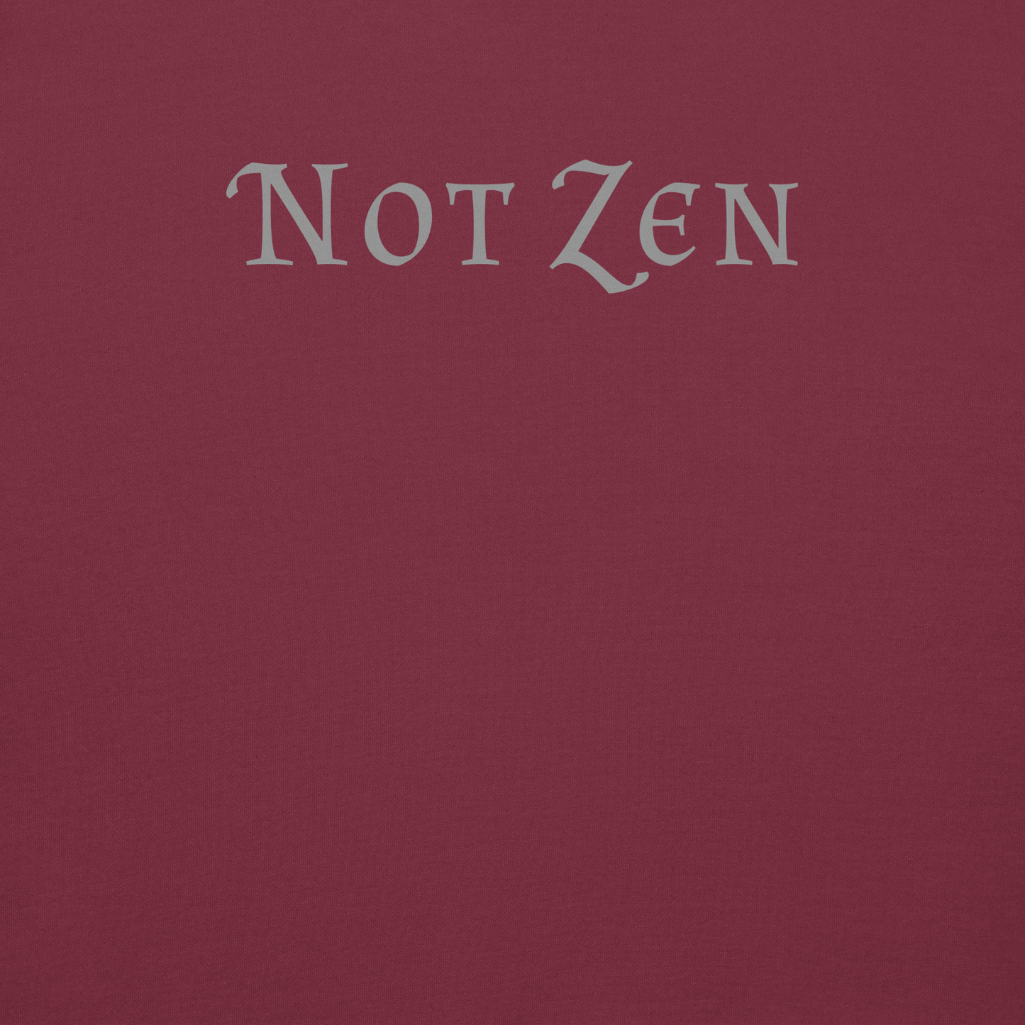 "Not zen" printed on a maroon background