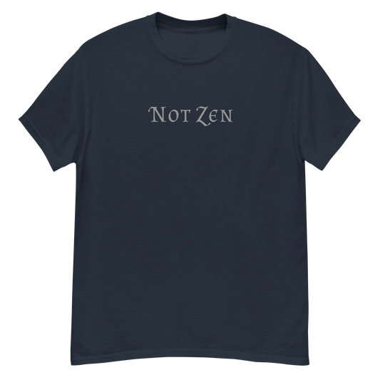 "Not zen" printed on a navy unisex classic tee laying on a flat surface
