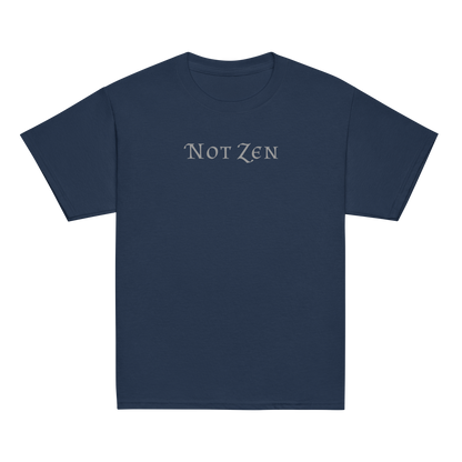 "Not zen" printed on a navy youth classic tee laying on a flat surface