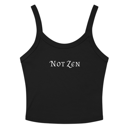 "Not zen" printed on a solid black blend women's micro-rib tanktop laying on a flat surface amongst sunglasses and shorts