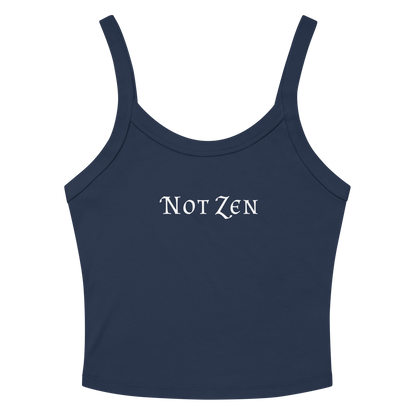 "Not zen" printed on a solid navy blend women's micro-rib tanktop laying on a flat surface amongst sunglasses and shorts