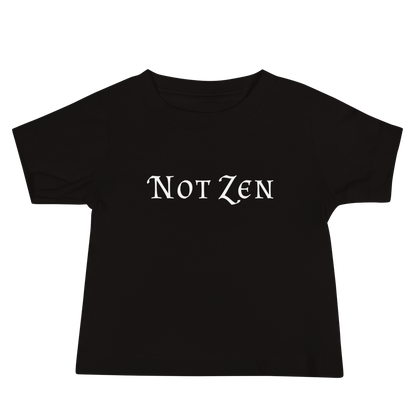 "Not zen" printed on a black baby jersey short sleeve tee laying on a flat surface
