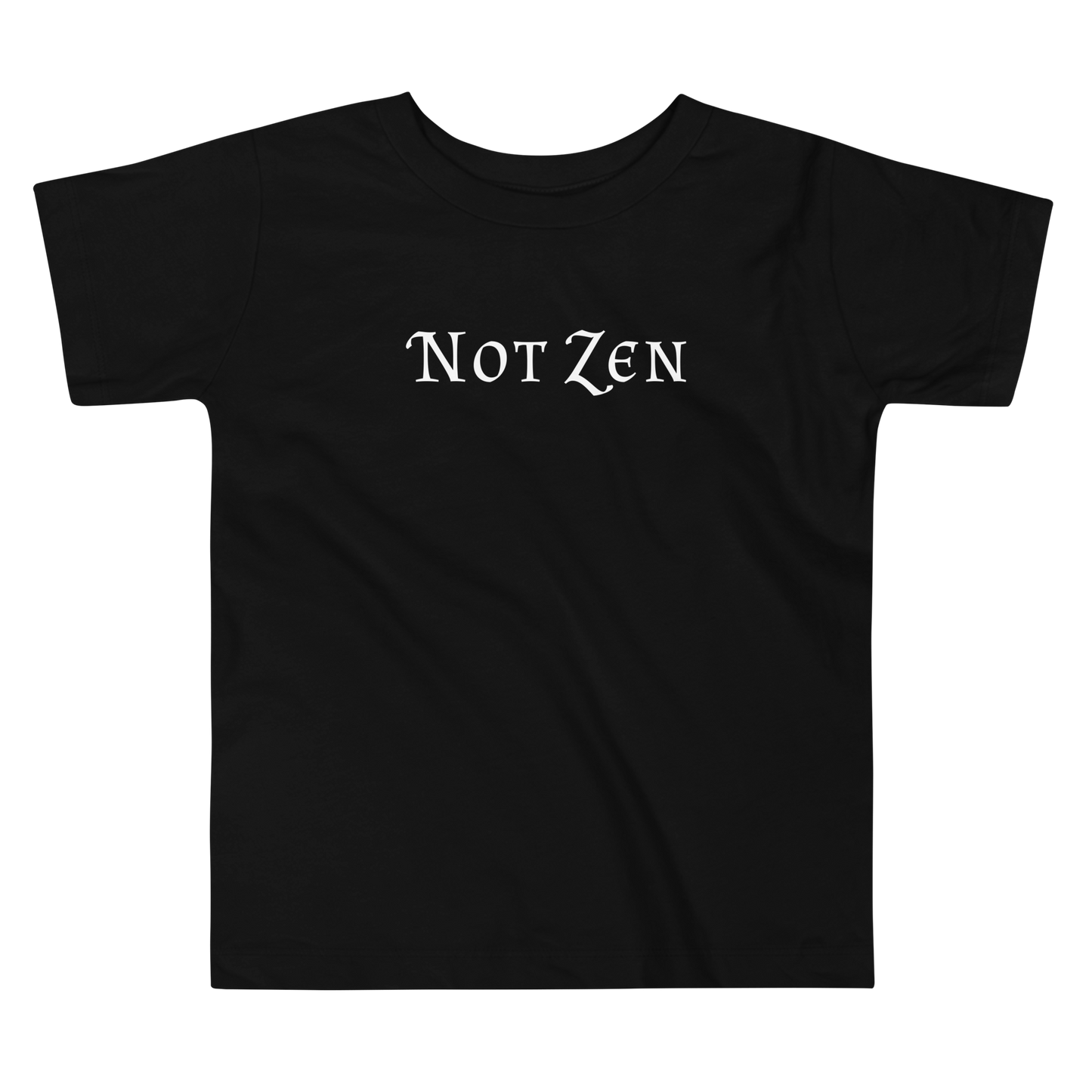 "Not zen" printed on a black toddler short sleeve tee laying on a flat surface