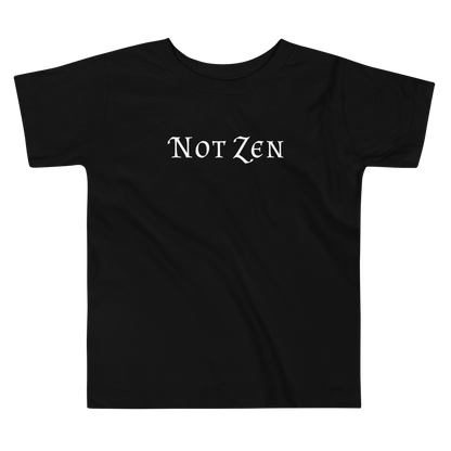 "Not zen" printed on a black toddler short sleeve tee laying on a flat surface