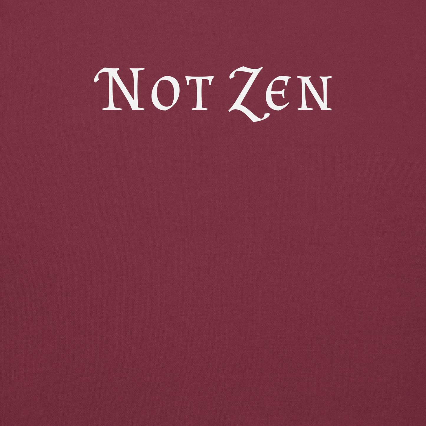"Not zen" printed on a maroon background