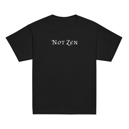 "Not zen" printed on a black youth classic tee laying on a flat surface
