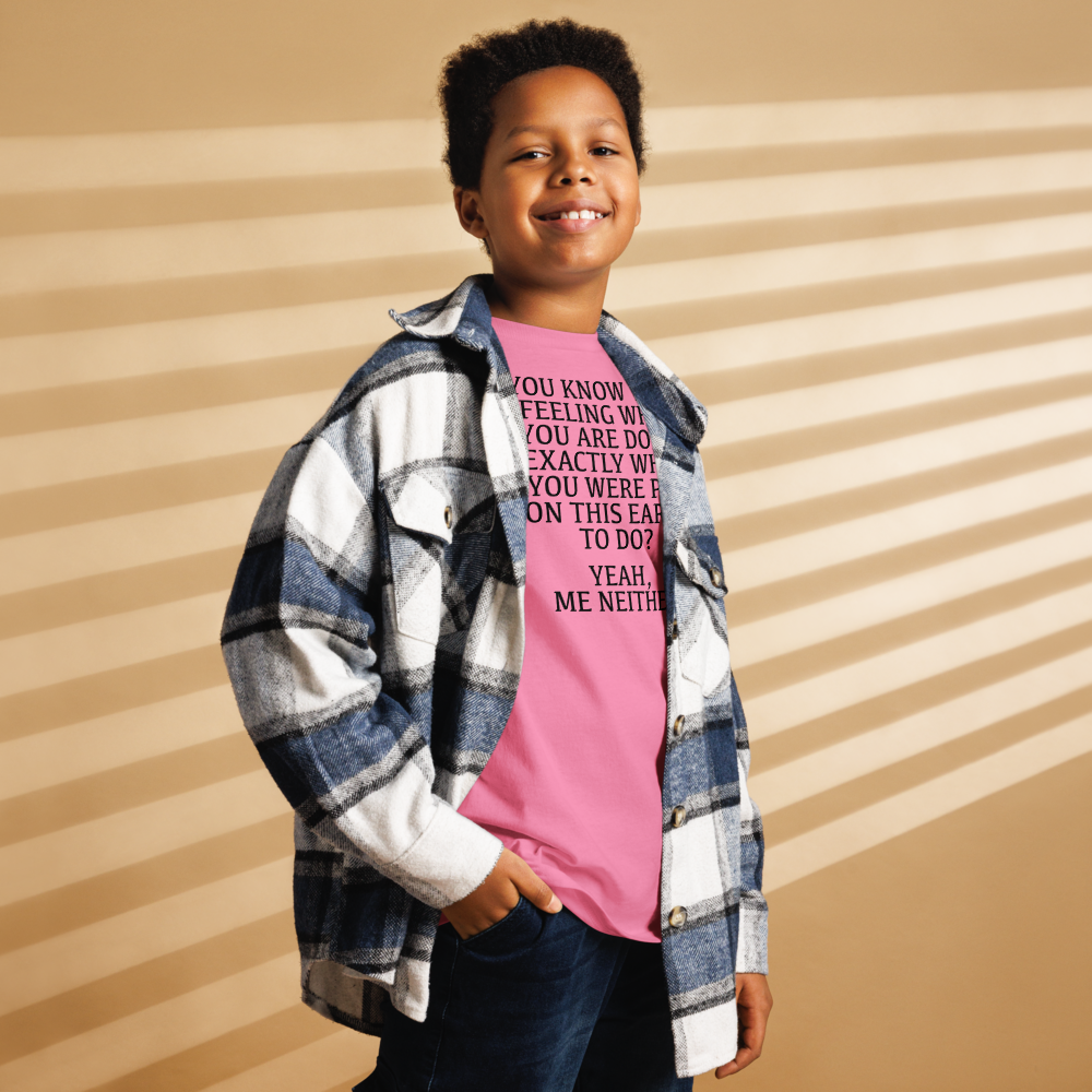 "You know that feeling when you are doing exactly what you were put on this earth to do? Yeah, Me Neither" printed on a azalea youth classic tee worn by a male also wearing a jacket