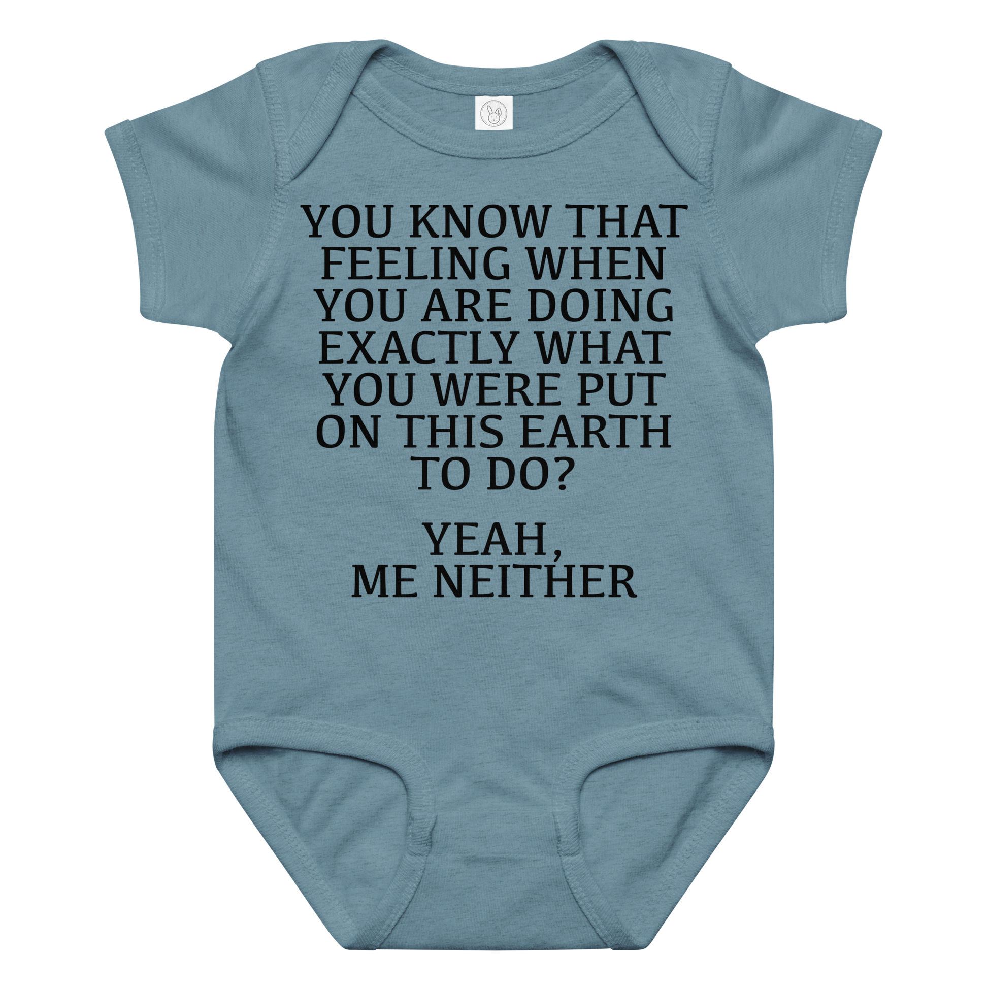 "You know that feeling when you are doing exactly what you were put on this earth to do? Yeah, Me Neither" printed on a vintage indigo baby jersey bodysuit laying on a flat surface amongst other clothes
