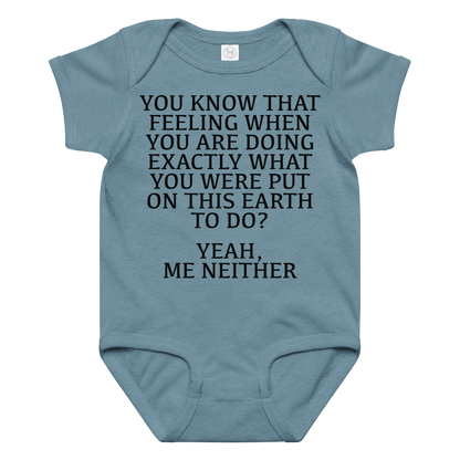 "You know that feeling when you are doing exactly what you were put on this earth to do? Yeah, Me Neither" printed on a vintage indigo baby jersey bodysuit laying on a flat surface amongst other clothes