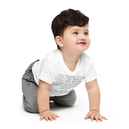 "You know that feeling when you are doing exactly what you were put on this earth to do? Yeah, Me Neither" printed on a white baby jersey short sleeve tee worn by a male who is crawling