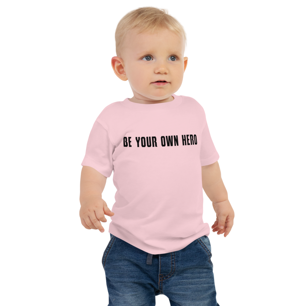 "Be your own here" printed on a pink baby jersey short sleeve tee worn by a male