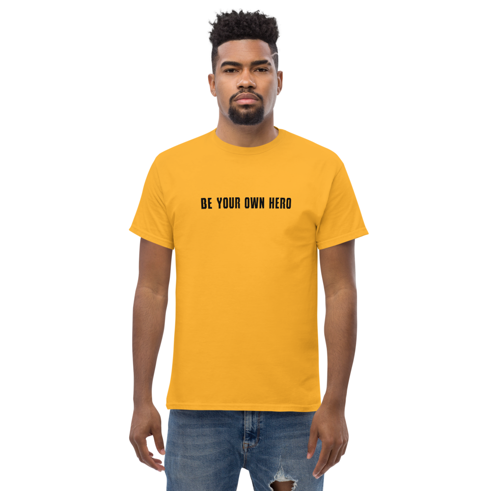 "Be your own here" printed on a gold unisex classic tee worn by a male