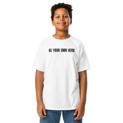 "Be your own here" printed on a white youth classic tee worn by a male