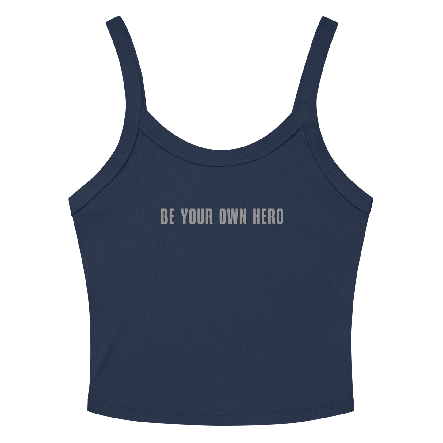 "Be your own here" printed on a solid navy blend women's micro-rib tanktop laying on a flat surface amongst sunglasses and shorts