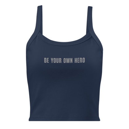 "Be your own here" printed on a solid navy blend women's micro-rib tanktop laying on a flat surface