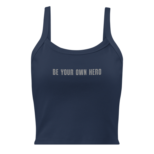"Be your own here" printed on a solid navy blend women's micro-rib tanktop laying on a flat surface