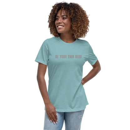 "Be your own here" printed on a heather blue lagoon women's relaxed t-shirt worn by a female