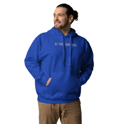 "Be your own here" printed on a team royal unisex hoodie worn by a male