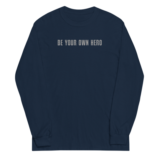 "Be your own here" printed on a navy men's long sleeve shirt laying on a flat surface