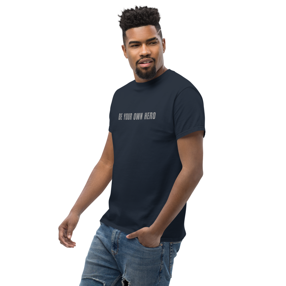 "Be your own here" printed on a navy unisex classic tee worn by a male