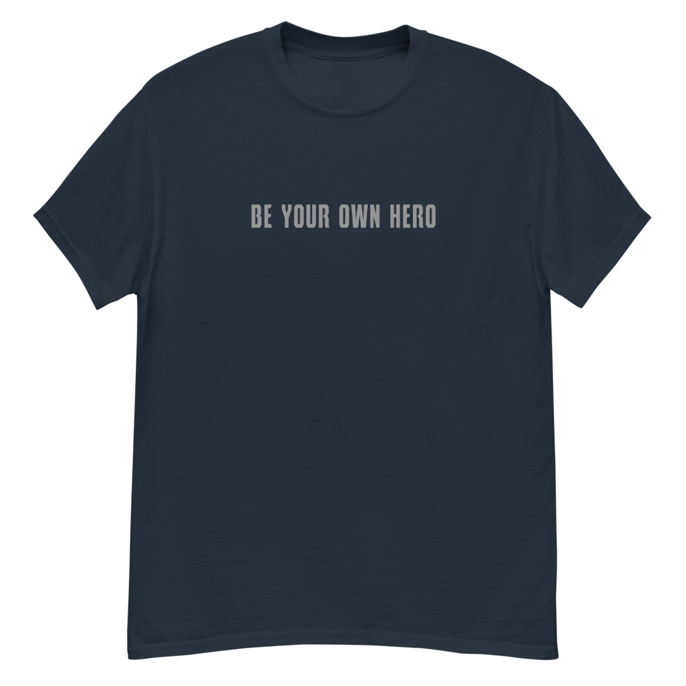 "Be your own here" printed on a navy unisex classic tee laying on a flat surface