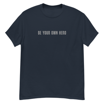 "Be your own here" printed on a navy unisex classic tee laying on a flat surface