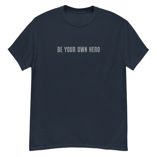 "Be your own here" printed on a navy unisex classic tee laying on a flat surface