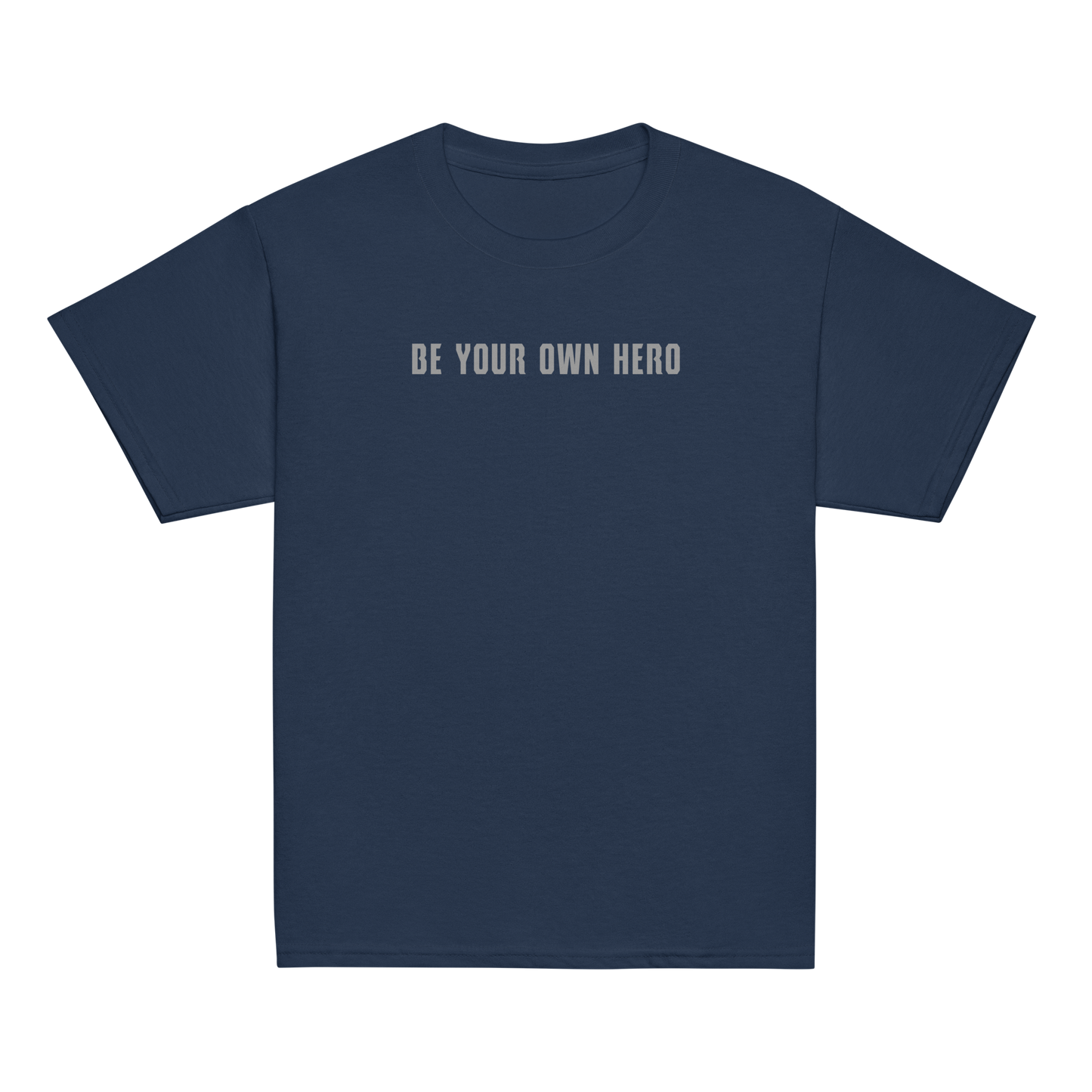 "Be your own here" printed on a navy youth classic tee laying on a flat surface