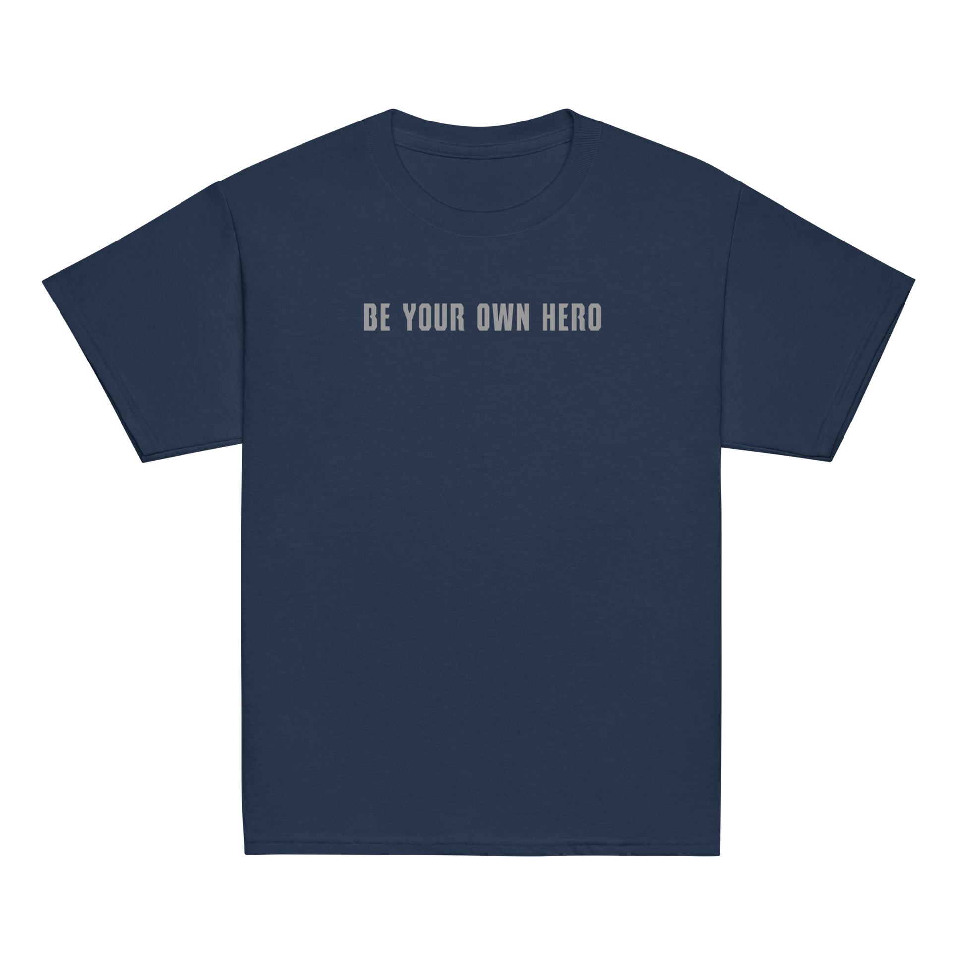 "Be your own here" printed on a navy youth classic tee laying on a flat surface