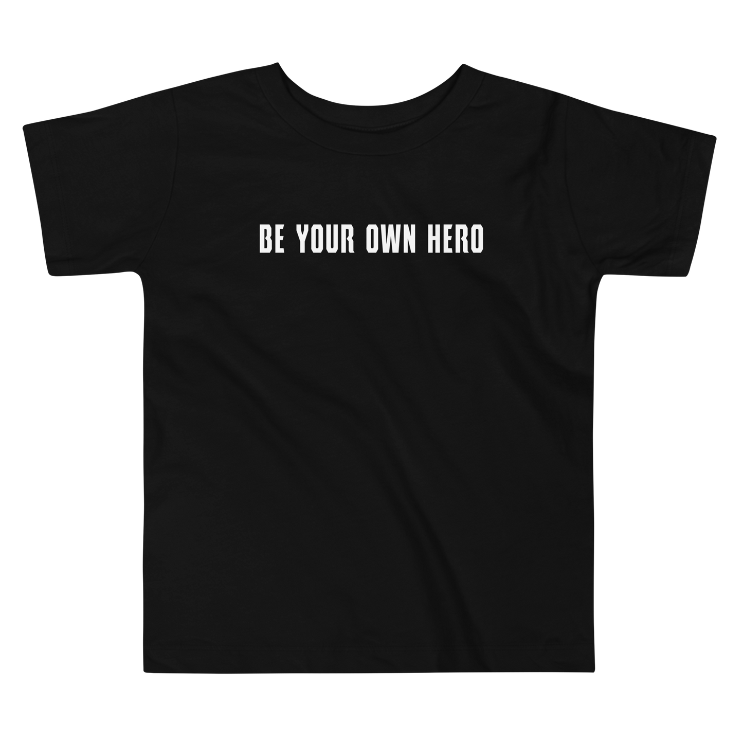 "Be your own here" printed on a black toddler short sleeve tee laying on a flat surface