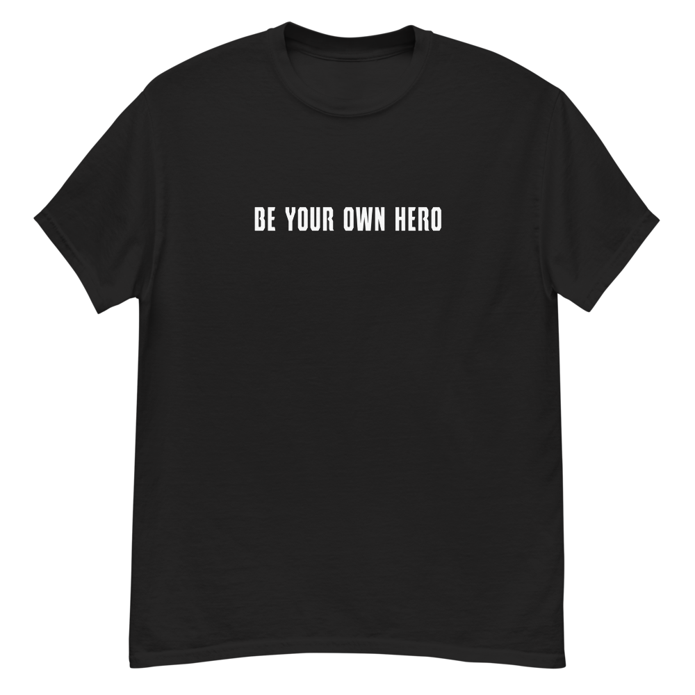 "Be your own here" printed on a black unisex classic tee laying on a flat surface