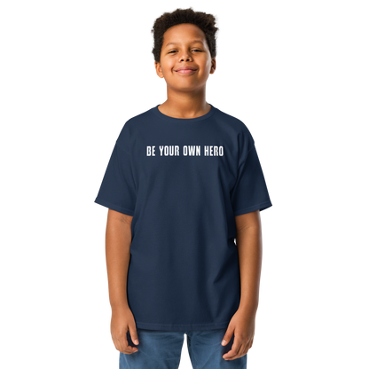 "Be your own here" printed on a navy youth classic tee worn by a male